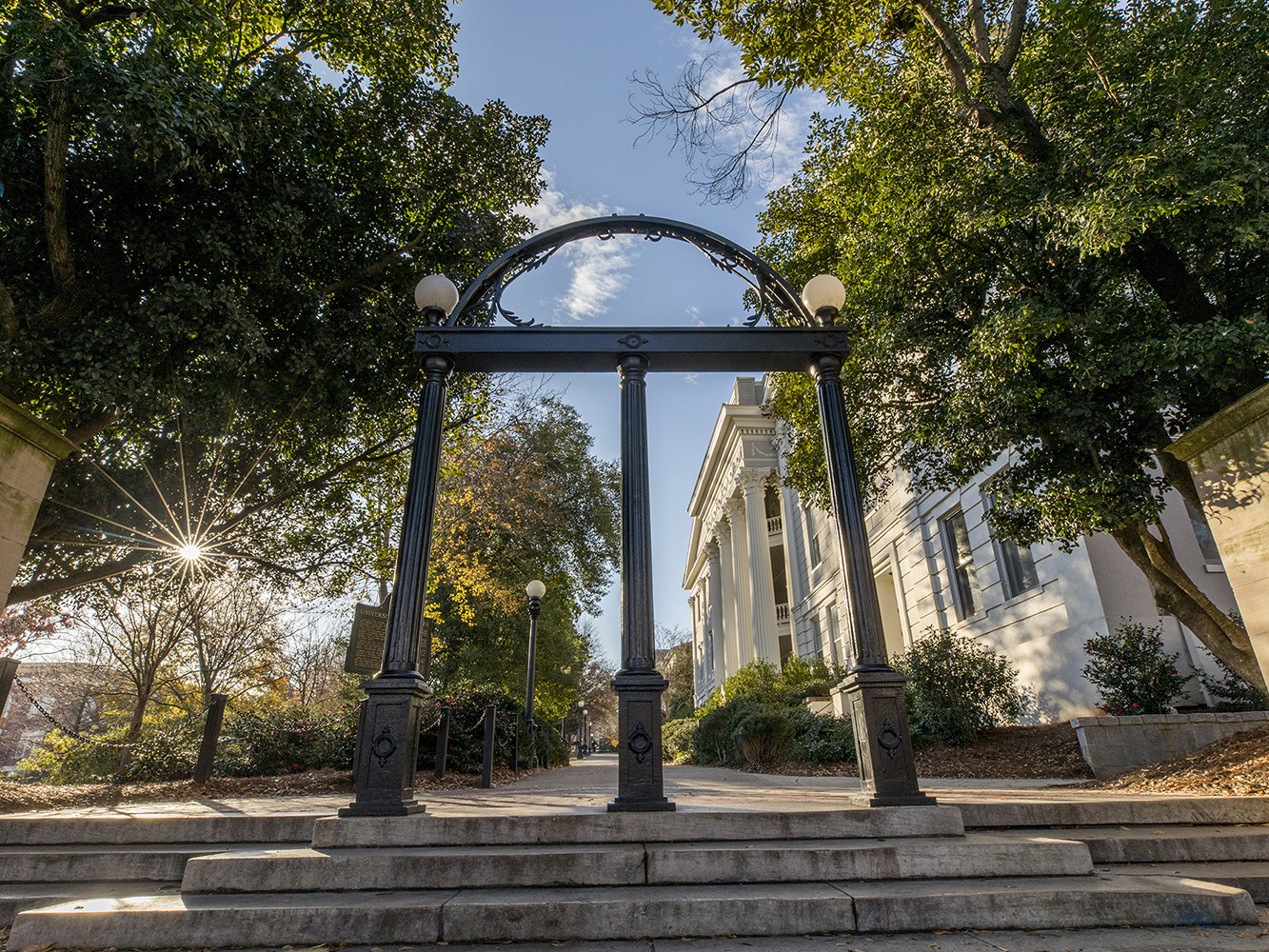 A photograph of the UGA Arch on a sunny day.