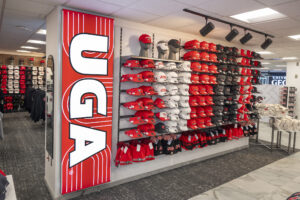 A wall of hats for sale in a bookstore