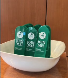 Green "Join Me" placards sitting in a bowl