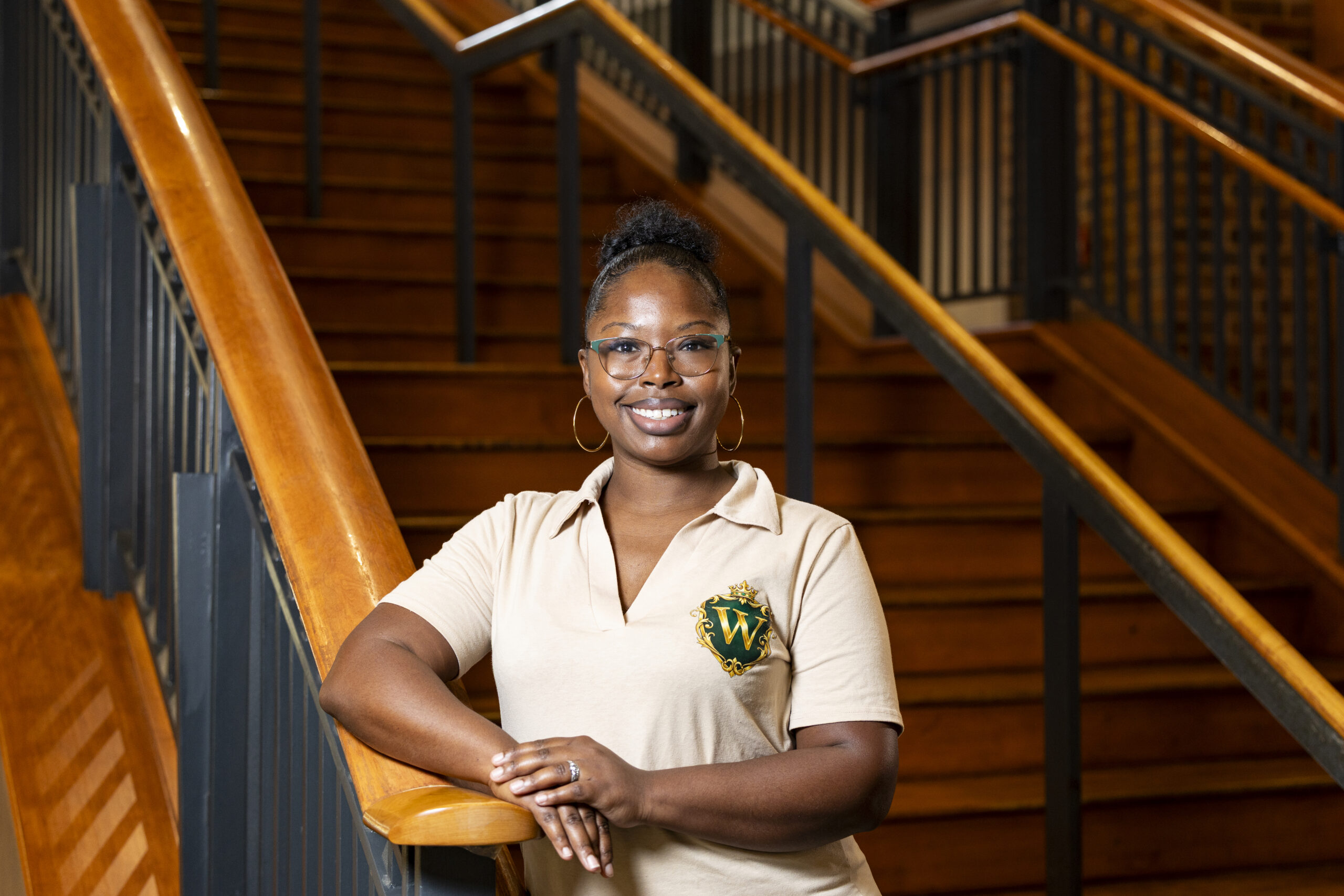 Portrait of Kimbree Woods Wallace, customer relations specialist for Transportation and Parking Services, at Joe Frank Harris Commons.