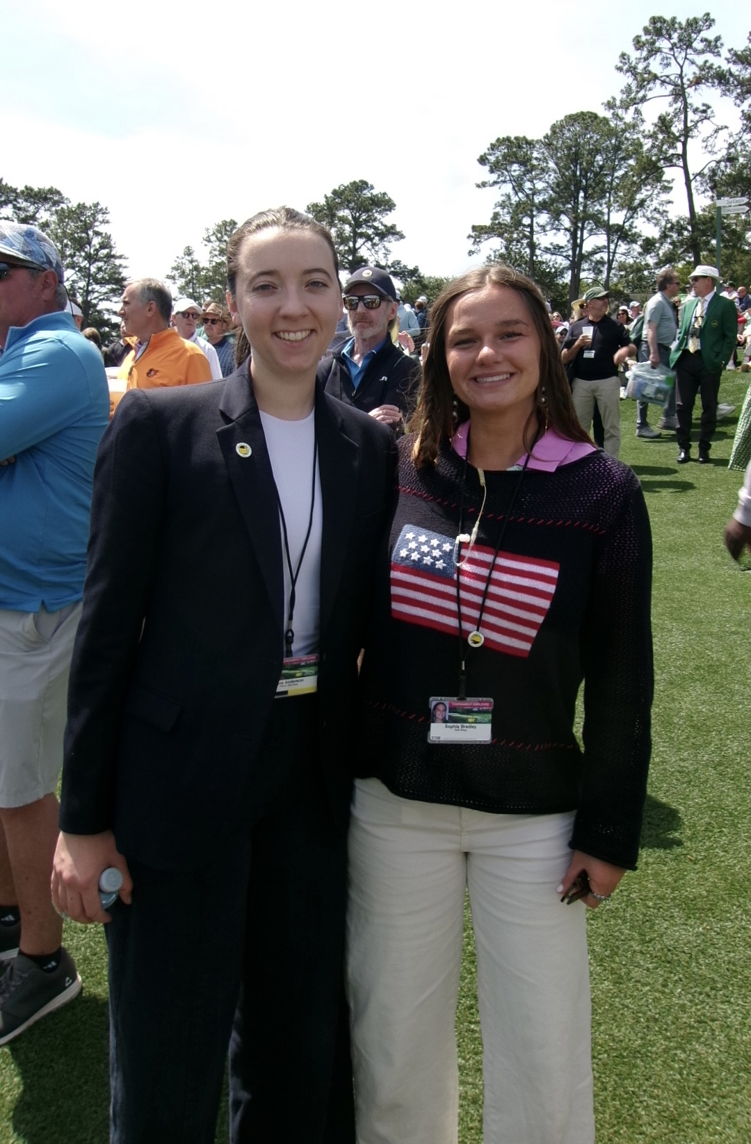 Two marketing student interns standing outside on golf course at Masters Tournament
